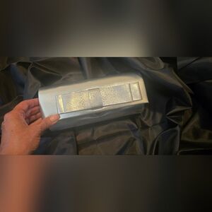 Elegant Silver Clutch with Bow Accent
